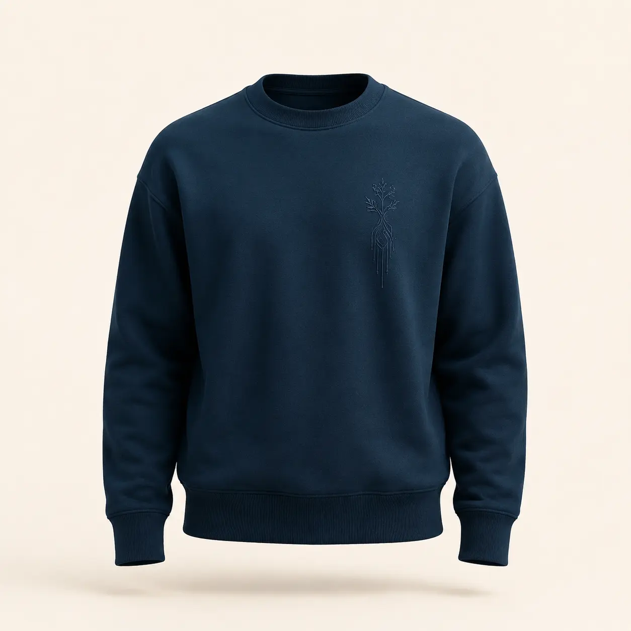 Deep indigo organic cotton crewneck with a tonal botanical fiber motif